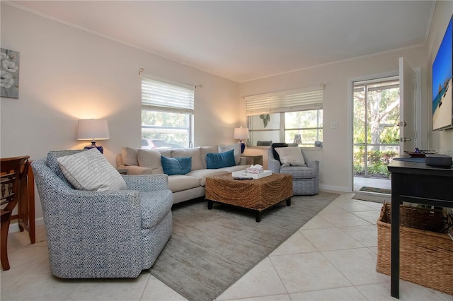 3745 Almeria Ave Unit 7S, Sarasota, FL 34239 - living area featuring light tile patterned floors, healthy amount of natural light, crown molding, and baseboards