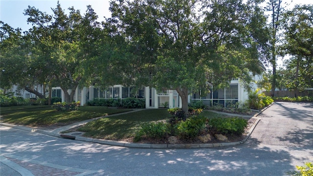 3745 Almeria Ave Unit 7S, Sarasota, FL 34239 - obstructed view of property featuring a front lawn