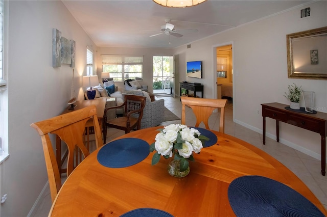 3745 Almeria Ave Unit 7S, Sarasota, FL 34239 - tiled dining space with ceiling fan and baseboards