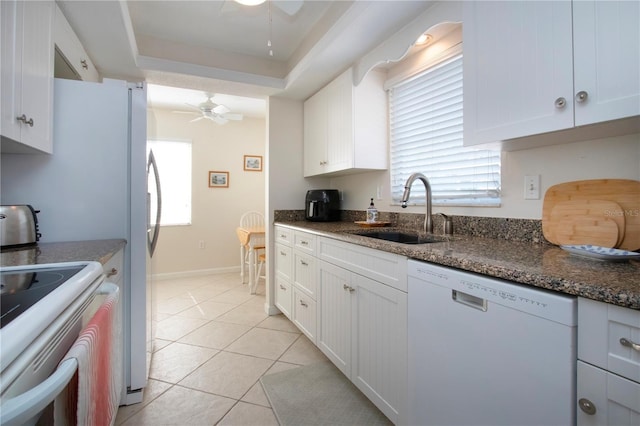 3745 Almeria Ave Unit 7S, Sarasota, FL 34239 - kitchen featuring white appliances, a ceiling fan, a sink, and white cabinets