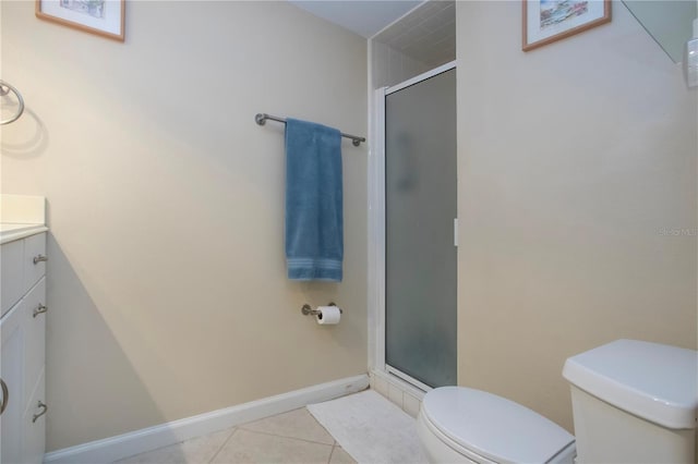 3745 Almeria Ave Unit 7S, Sarasota, FL 34239 - full bathroom featuring toilet, vanity, a stall shower, and tile patterned floors