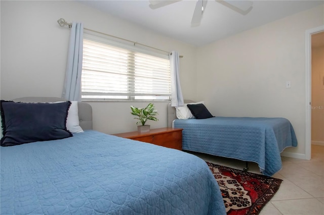 3745 Almeria Ave Unit 7S, Sarasota, FL 34239 - bedroom with light tile patterned floors and a ceiling fan