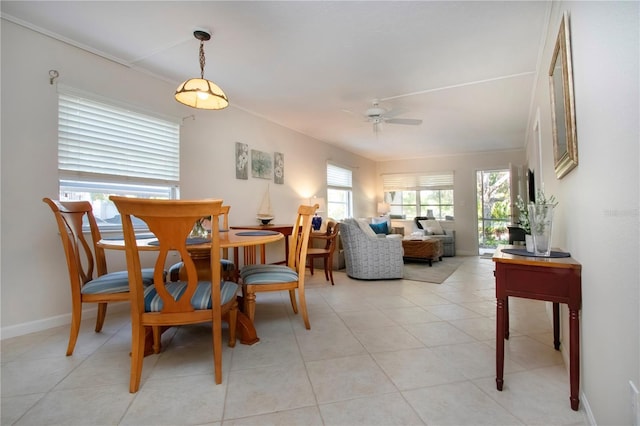 3745 Almeria Ave Unit 7S, Sarasota, FL 34239 - dining area featuring a ceiling fan, baseboards, and light tile patterned floors