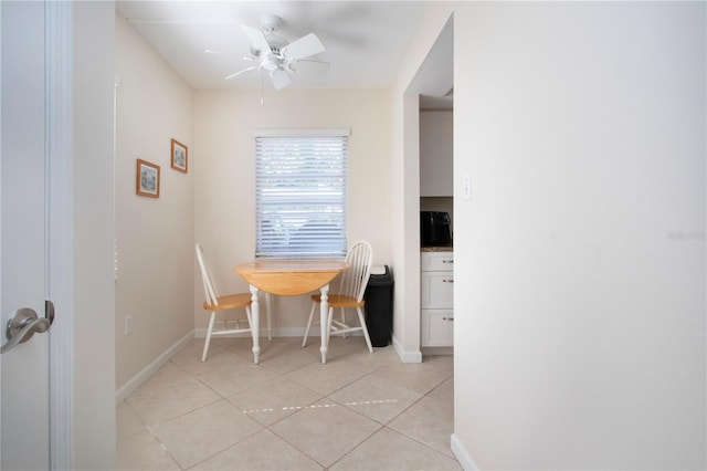 3745 Almeria Ave Unit 7S, Sarasota, FL 34239 - dining space with light tile patterned flooring, baseboards, and a ceiling fan