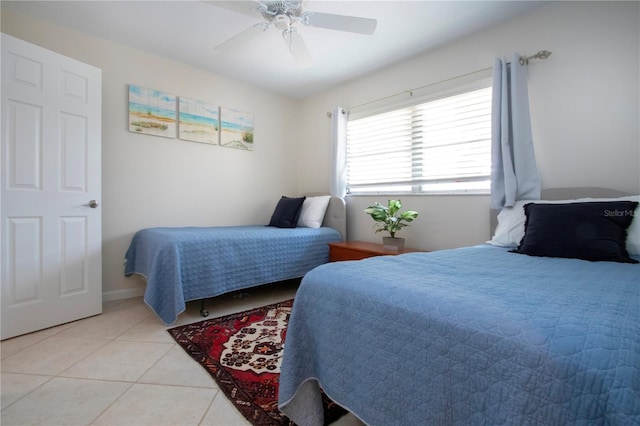 3745 Almeria Ave Unit 7S, Sarasota, FL 34239 - bedroom featuring light tile patterned floors and ceiling fan