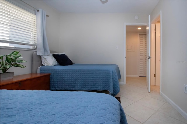 3745 Almeria Ave Unit 7S, Sarasota, FL 34239 - bedroom featuring light tile patterned flooring and baseboards