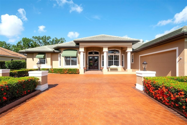 2901 Little Country Rd, Parrish, FL 34219 - view of front facade featuring french doors, stucco siding, and a tile roof