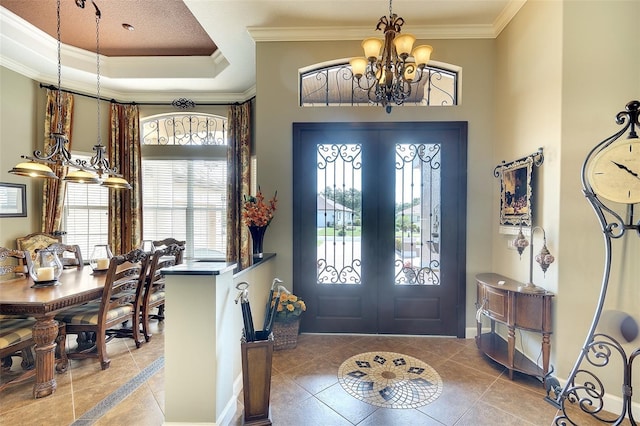2901 Little Country Rd, Parrish, FL 34219 - tiled entrance foyer with a chandelier, french doors, crown molding, baseboards, and a raised ceiling