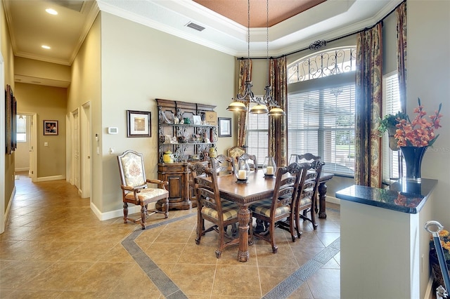 2901 Little Country Rd, Parrish, FL 34219 - dining area featuring a towering ceiling, crown molding, recessed lighting, baseboards, and a tray ceiling