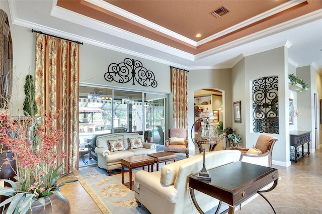2901 Little Country Rd, Parrish, FL 34219 - living area featuring a raised ceiling, arched walkways, ornamental molding, and light tile patterned floors
