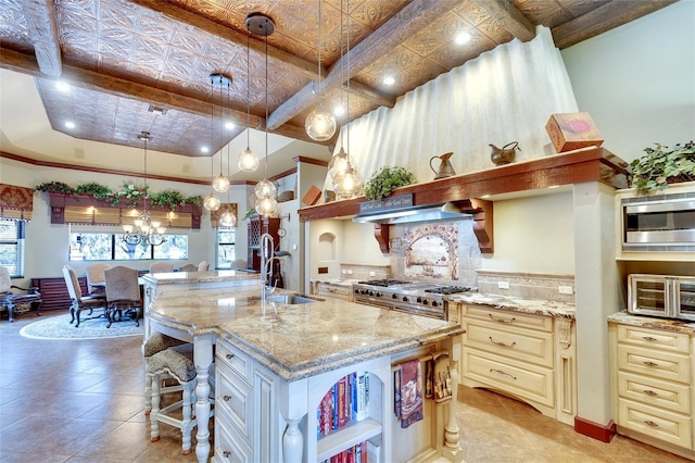 2901 Little Country Rd, Parrish, FL 34219 - kitchen featuring cream cabinetry, open shelves, a sink, stainless steel appliances, and plenty of natural light