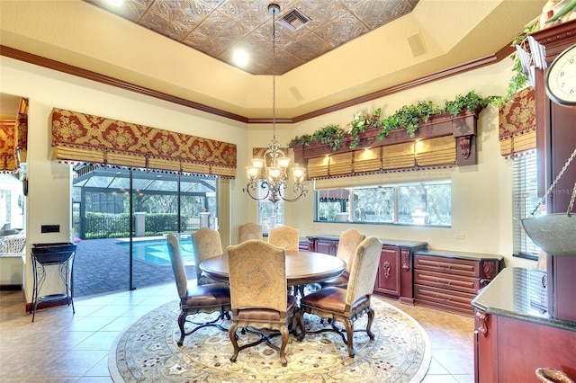 2901 Little Country Rd, Parrish, FL 34219 - dining area featuring light tile patterned floors, a chandelier, and an ornate ceiling