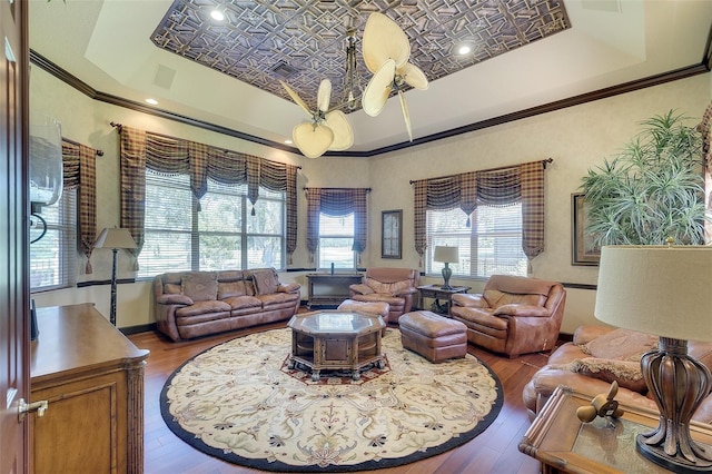 2901 Little Country Rd, Parrish, FL 34219 - living room with a tray ceiling, wood-type flooring, and crown molding