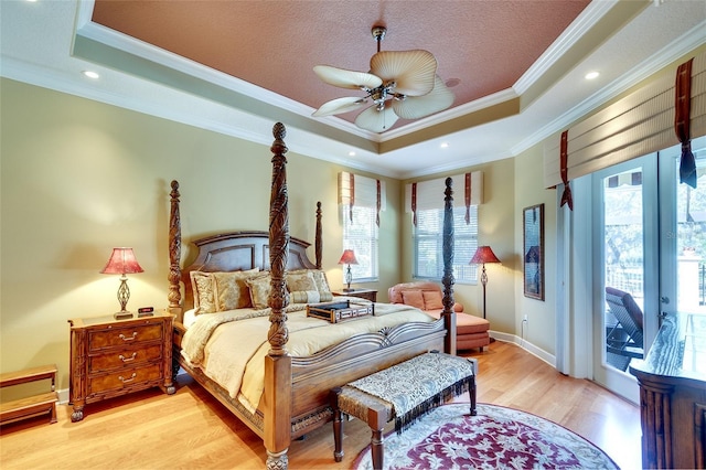 2901 Little Country Rd, Parrish, FL 34219 - bedroom featuring a raised ceiling, ornamental molding, light wood-style floors, access to exterior, and baseboards