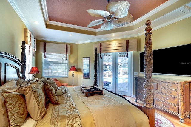 2901 Little Country Rd, Parrish, FL 34219 - bedroom featuring access to outside, ornamental molding, a raised ceiling, wood finished floors, and ceiling fan
