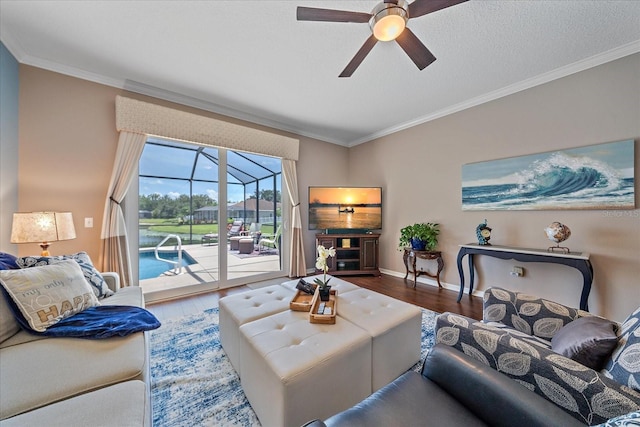 12322 Tall Pines Way, Lakewood Ranch, FL 34202 - living room with wood finished floors, a ceiling fan, ornamental molding, and baseboards