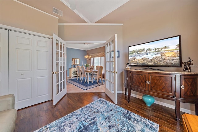 12322 Tall Pines Way, Lakewood Ranch, FL 34202 - entrance foyer with french doors, ornamental molding, hardwood / wood-style flooring, a chandelier, and baseboards