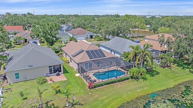 12322 Tall Pines Way, Lakewood Ranch, FL 34202 - aerial view of residential area with a pool area and a nearby body of water