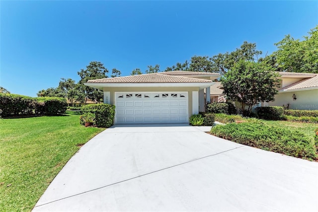 7023 Woodside Oaks Cir Unit 1, Sarasota, FL 34231 - view of front of house featuring driveway, a front yard, a tile roof, and stucco siding