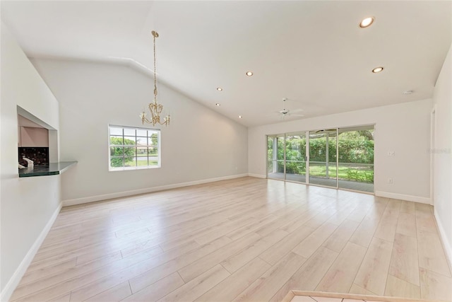 7023 Woodside Oaks Cir Unit 1, Sarasota, FL 34231 - unfurnished living room with plenty of natural light, light wood-style floors, recessed lighting, a chandelier, and baseboards