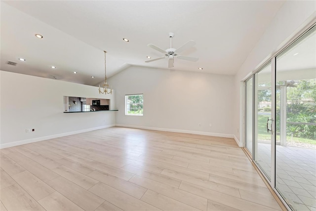 7023 Woodside Oaks Cir Unit 1, Sarasota, FL 34231 - unfurnished living room featuring light wood-style flooring, a ceiling fan, vaulted ceiling, a chandelier, and recessed lighting