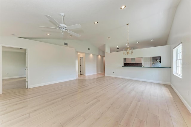 7023 Woodside Oaks Cir Unit 1, Sarasota, FL 34231 - unfurnished living room featuring a chandelier, a ceiling fan, light wood-type flooring, recessed lighting, and baseboards