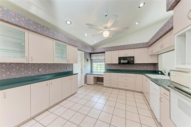 7023 Woodside Oaks Cir Unit 1, Sarasota, FL 34231 - kitchen with lofted ceiling, white appliances, tasteful backsplash, a sink, and ceiling fan