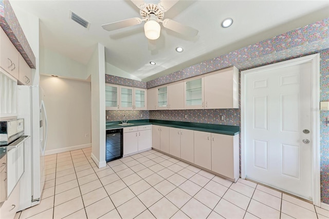 7023 Woodside Oaks Cir Unit 1, Sarasota, FL 34231 - kitchen featuring wine cooler, light tile patterned flooring, dark countertops, tasteful backsplash, and glass insert cabinets