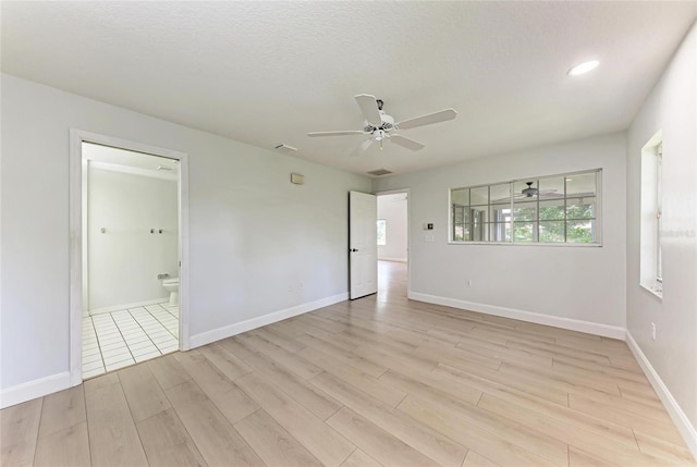 7023 Woodside Oaks Cir Unit 1, Sarasota, FL 34231 - spare room with light wood-style floors, a ceiling fan, baseboards, and recessed lighting