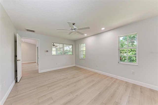 7023 Woodside Oaks Cir Unit 1, Sarasota, FL 34231 - spare room featuring light wood-type flooring, a ceiling fan, recessed lighting, and baseboards