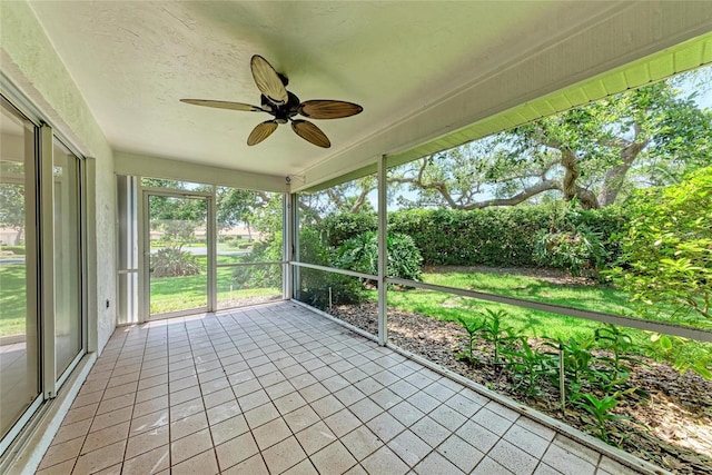 7023 Woodside Oaks Cir Unit 1, Sarasota, FL 34231 - unfurnished sunroom featuring ceiling fan