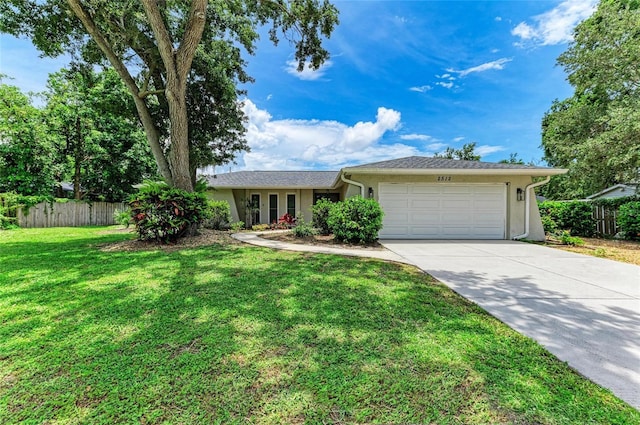 7023 Woodside Oaks Cir Unit 1, Sarasota, FL 34231 - ranch-style home with a garage, concrete driveway, and stucco siding