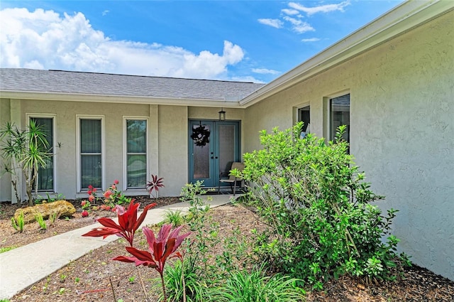 7023 Woodside Oaks Cir Unit 1, Sarasota, FL 34231 - view of exterior entry with stucco siding