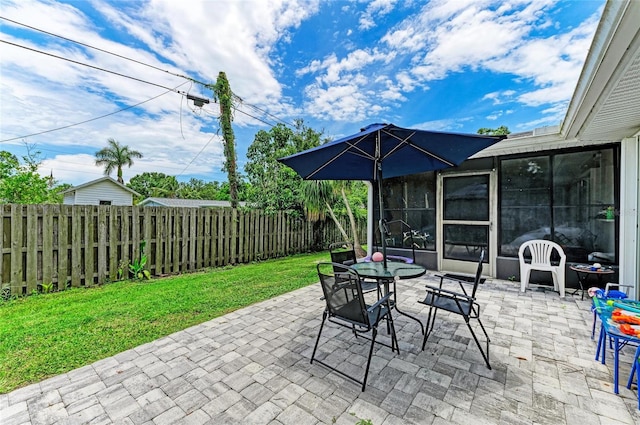 7023 Woodside Oaks Cir Unit 1, Sarasota, FL 34231 - fenced backyard featuring a patio area and outdoor dining area