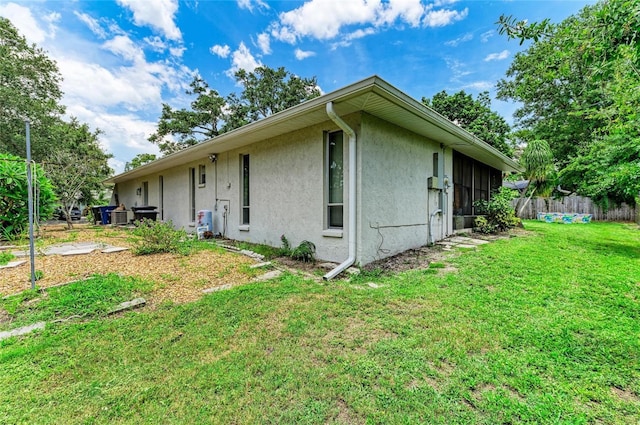 7023 Woodside Oaks Cir Unit 1, Sarasota, FL 34231 - view of side of home featuring stucco siding