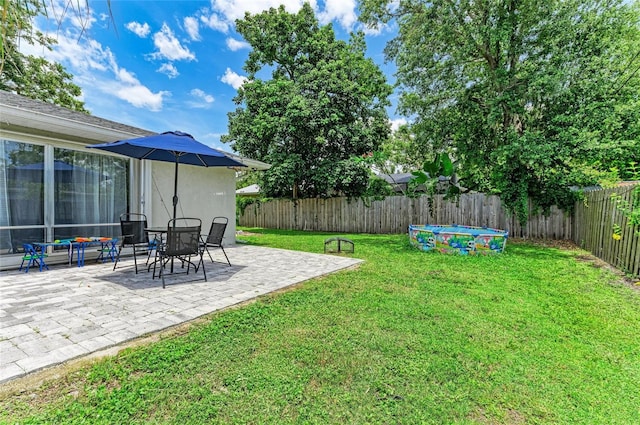 7023 Woodside Oaks Cir Unit 1, Sarasota, FL 34231 - fenced backyard featuring a patio area