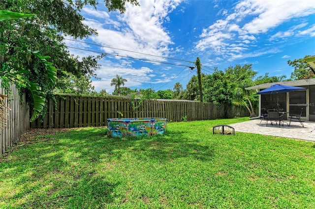 7023 Woodside Oaks Cir Unit 1, Sarasota, FL 34231 - fenced backyard with a patio area