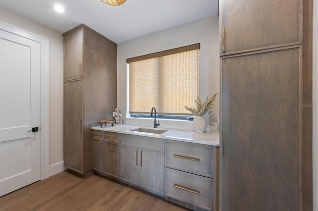 401 39th St, Holmes Beach, FL 34217 - bathroom featuring wood finished floors, vanity, baseboards, and recessed lighting