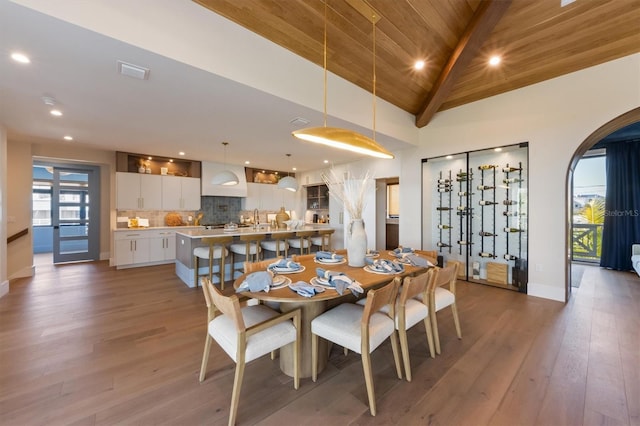401 39th St, Holmes Beach, FL 34217 - dining room featuring wood finished floors, wooden ceiling with exposed beams, recessed lighting, baseboards, and high vaulted ceiling