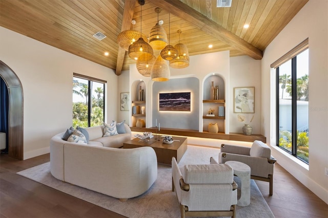 401 39th St, Holmes Beach, FL 34217 - living room featuring a chandelier, built in features, wooden ceiling with exposed beams, wood finished floors, and baseboards