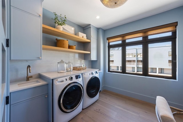 401 39th St, Holmes Beach, FL 34217 - laundry area featuring cabinet space, washer and clothes dryer, light wood-type flooring, baseboards, and recessed lighting