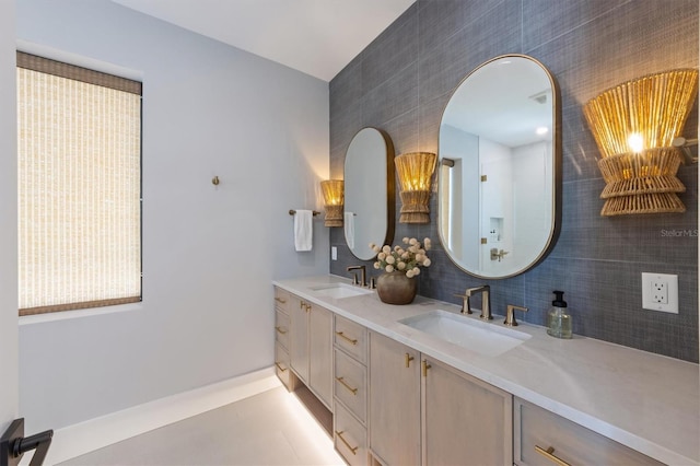 401 39th St, Holmes Beach, FL 34217 - bathroom with double vanity and baseboards