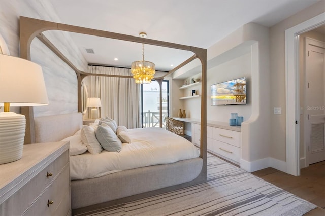 401 39th St, Holmes Beach, FL 34217 - bedroom with wood finished floors, a chandelier, baseboards, and recessed lighting
