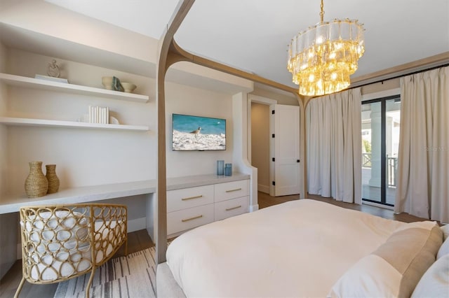 401 39th St, Holmes Beach, FL 34217 - bedroom with access to outside, a chandelier, and wood finished floors