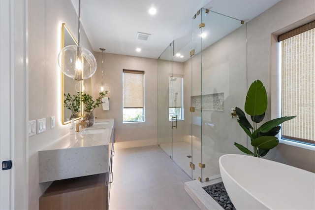 401 39th St, Holmes Beach, FL 34217 - full bath featuring a stall shower, a soaking tub, double vanity, and recessed lighting