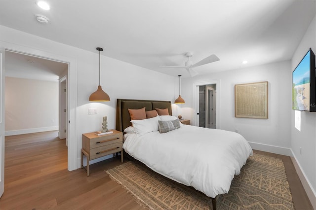 401 39th St, Holmes Beach, FL 34217 - bedroom featuring wood finished floors, a ceiling fan, recessed lighting, and baseboards