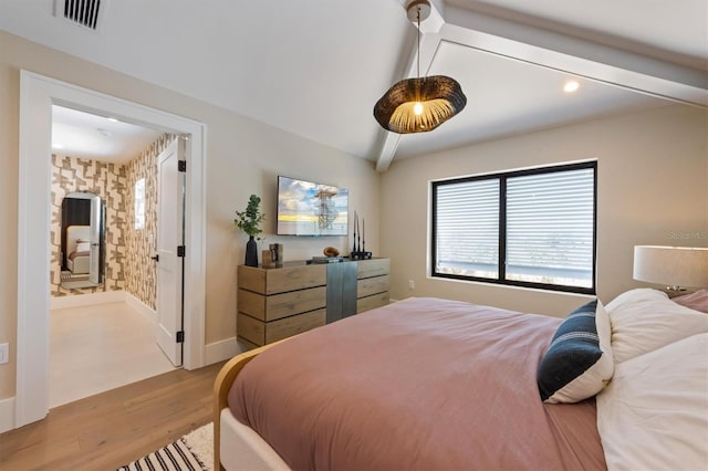 401 39th St, Holmes Beach, FL 34217 - bedroom with wood finished floors, recessed lighting, connected bathroom, and baseboards