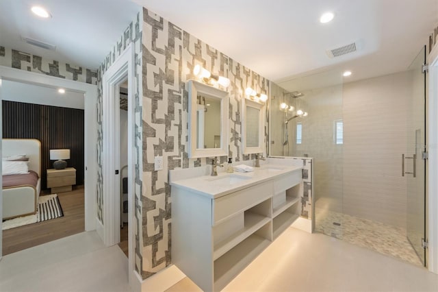 401 39th St, Holmes Beach, FL 34217 - bathroom featuring ensuite bathroom, double vanity, tiled shower, recessed lighting, and wallpapered walls