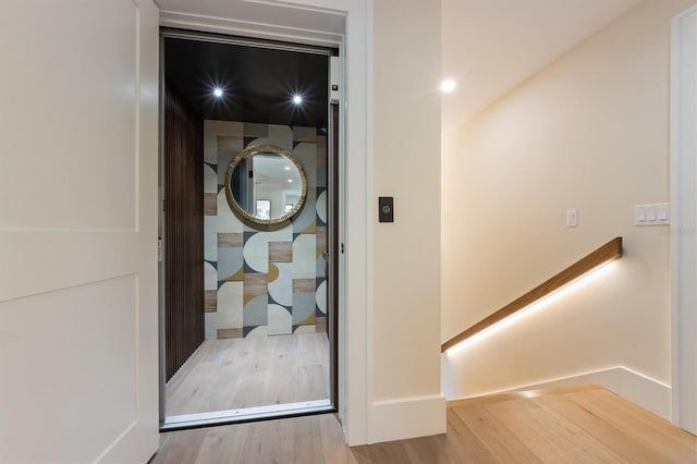 401 39th St, Holmes Beach, FL 34217 - elevator with wood finished floors and baseboards
