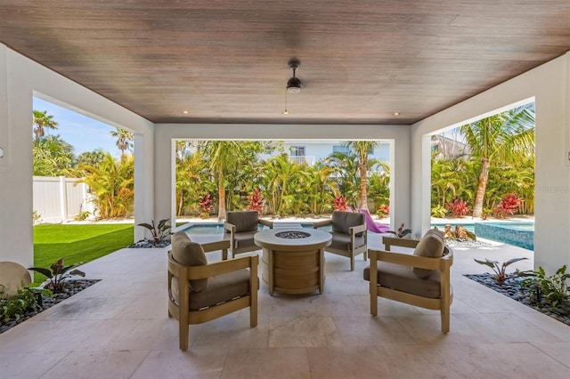 401 39th St, Holmes Beach, FL 34217 - fenced backyard featuring a fire pit and a patio area